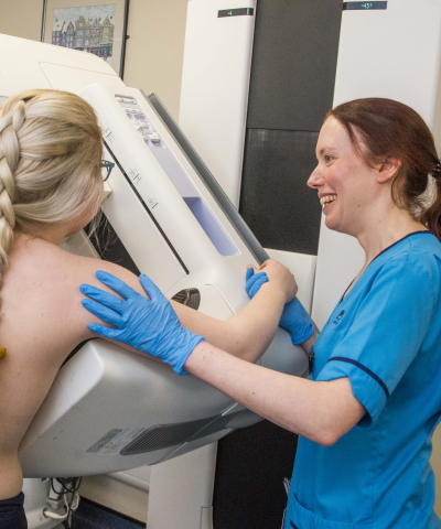 A nurse with patient performing a breast scan